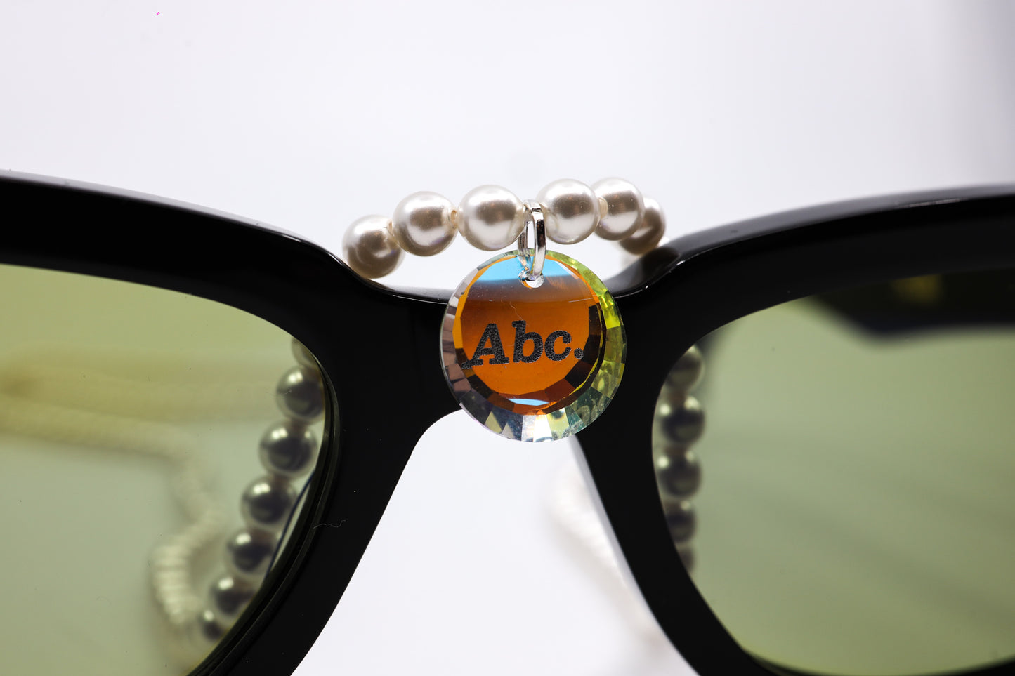ADVISORY BOARD CRYSTALS (ABC) BLACK FRAMES WITH PEARL EYEGLASS CHAIN