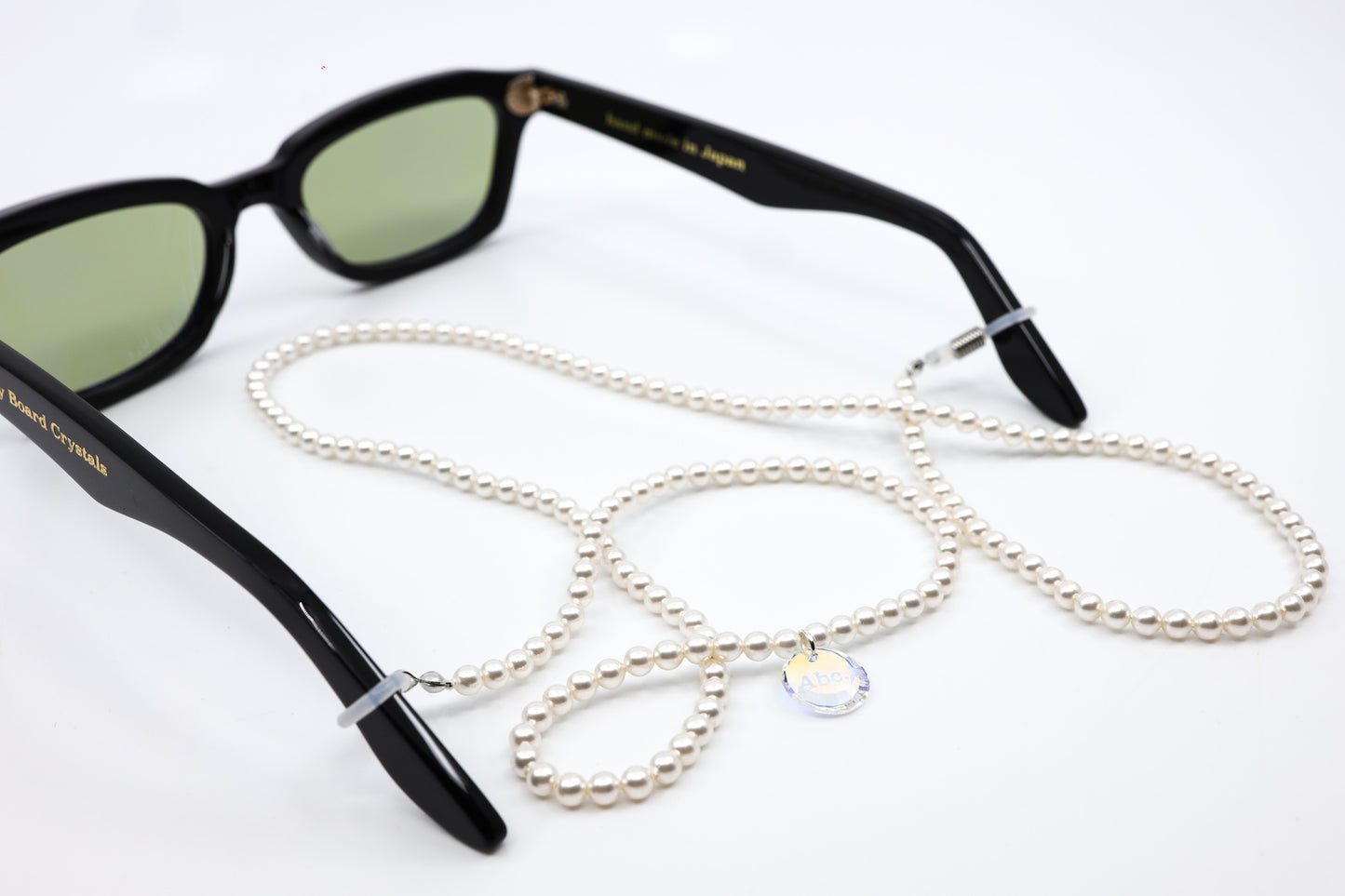 ADVISORY BOARD CRYSTALS (ABC) BLACK FRAMES WITH PEARL EYEGLASS CHAIN