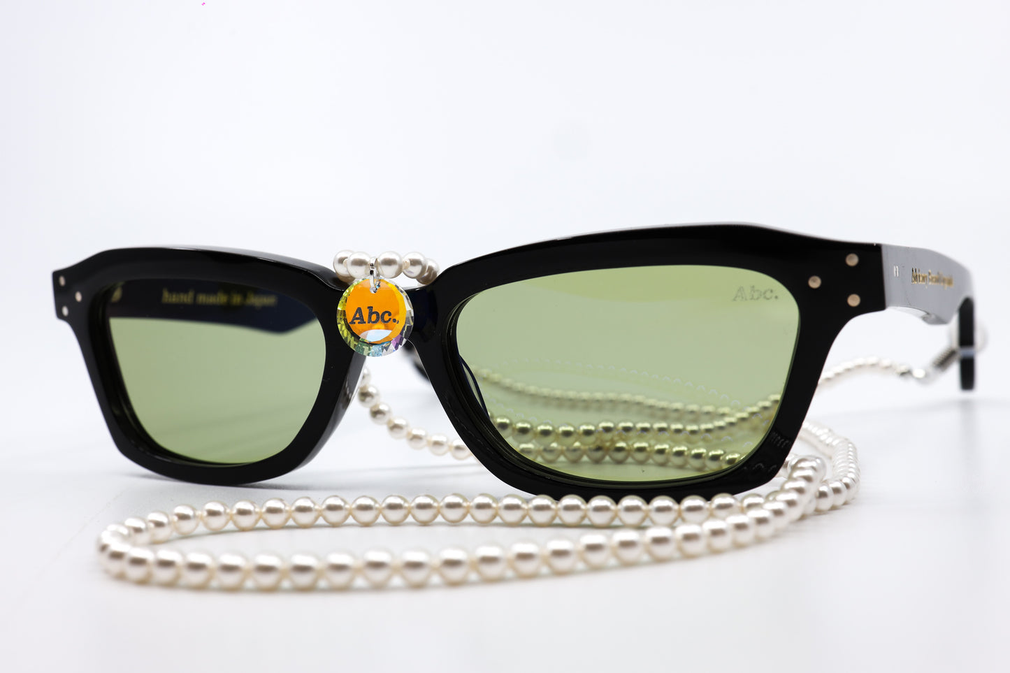 ADVISORY BOARD CRYSTALS (ABC) BLACK FRAMES WITH PEARL EYEGLASS CHAIN