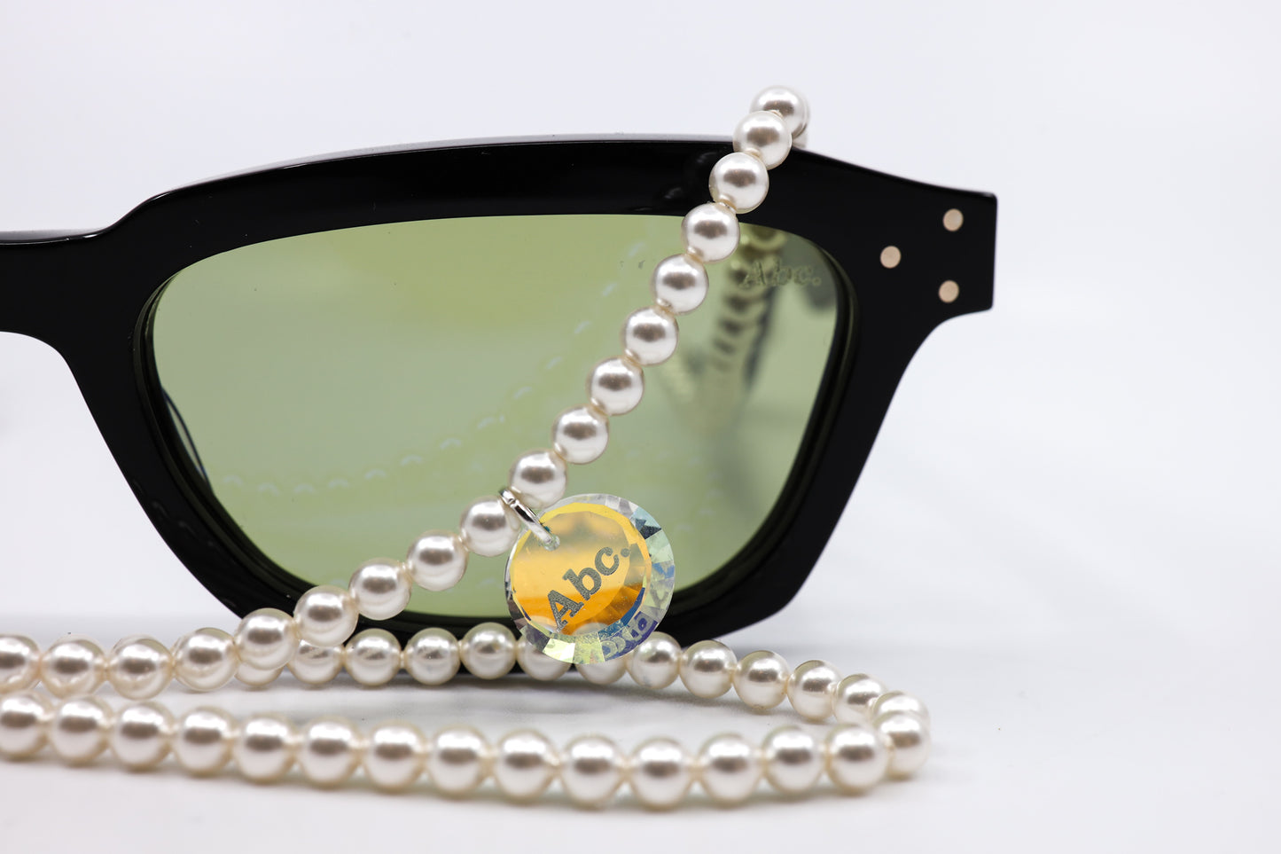 ADVISORY BOARD CRYSTALS (ABC) BLACK FRAMES WITH PEARL EYEGLASS CHAIN